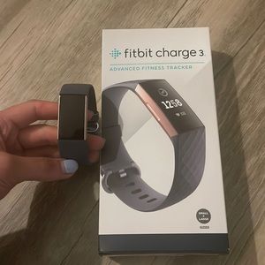 Fitbit charge 3 in dark grey and rose gold